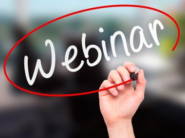 Man Hand writing Webinar black marker on visual screen