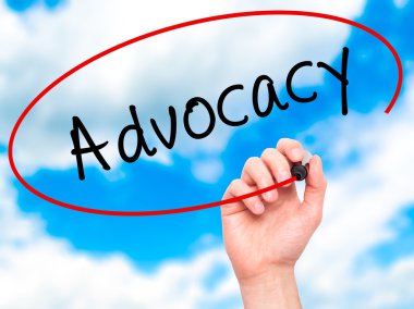 Man Hand writing Advocacy with marker on transparent wipe board