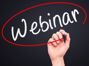 Man Hand writing Webinar black marker on visual screen