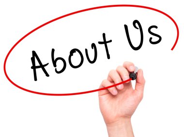 Man Hand writing About Us with marker on transparent wipe board