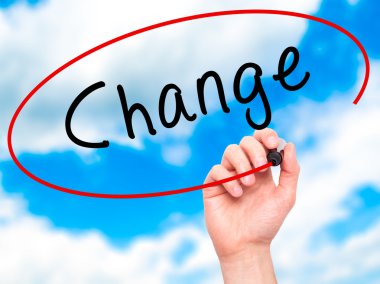 Man Hand writing Change with marker on transparent wipe board