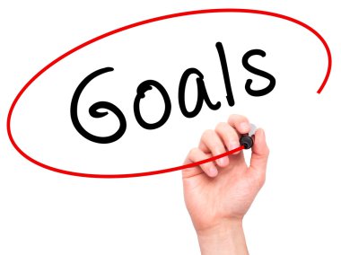 Man hand writing Goals on visual screen