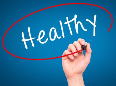 Man Hand writing Healthy with marker on transparent wipe board