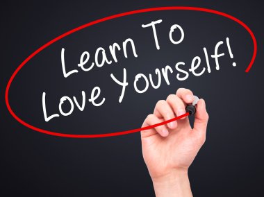 Man Hand writing Learn To Love Yourself with marker on transpare