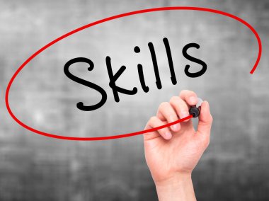 Man Hand writing Skills with marker on transparent wipe board