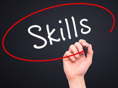 Man Hand writing Skills with marker on transparent wipe board