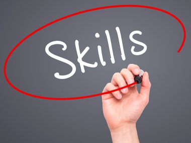 Man Hand writing Skills with marker on transparent wipe board