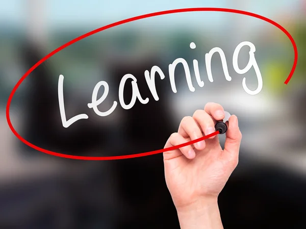 Man Hand writing Learning with marker on transparent wipe board — Stockfoto