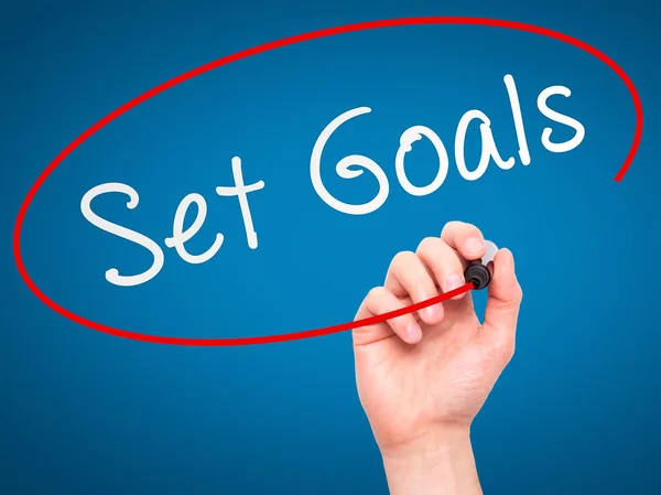 Man hand writing Set Goals on visual screen — Stock Photo, Image