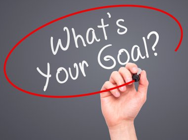 Man hand writing Whats Your Goal on visual screen
