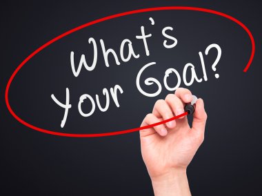 Man hand writing Whats Your Goal on visual screen