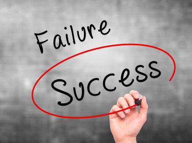Man Hand writing and choosing, Success instead of Failure, with 