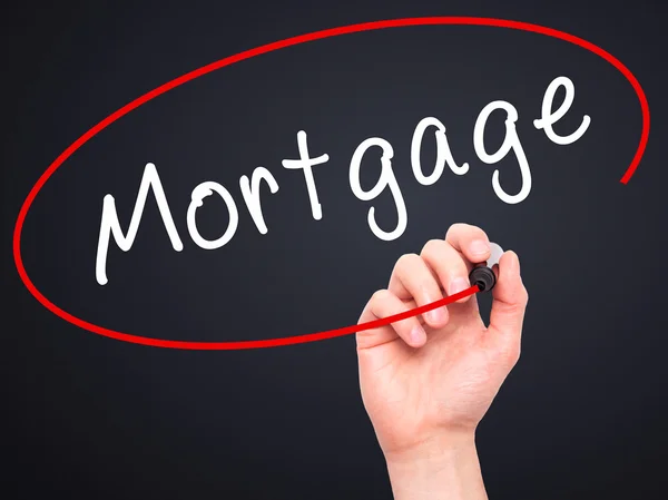 Man Hand writing Mortgage com marcador preto na tela visual — Fotografia de Stock
