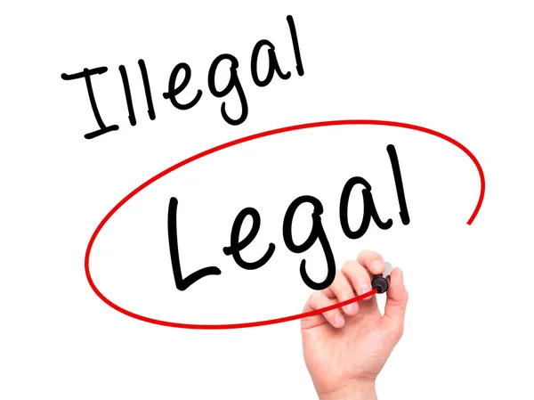 Man Hand writing and Choosing Legal instead of Illegal with blac — Φωτογραφία Αρχείου