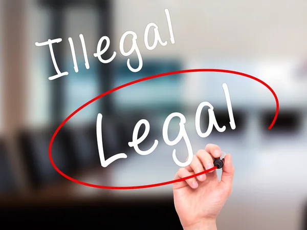 Man Hand writing and Choosing Legal instead of Illegal with blac — Φωτογραφία Αρχείου