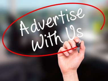 Man Hand writing Advertise With Us  with black marker on visual 