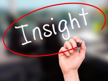 Man Hand writing Insight with marker on transparent wipe board