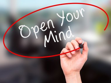 Man hand writing Open Your Mind with marker on transparent scree