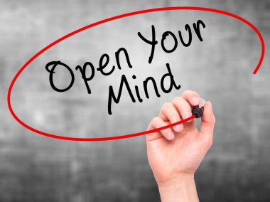 Man hand writing Open Your Mind with marker on transparent scree