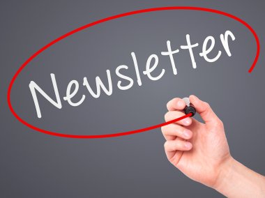Man Hand writing Newsletter on visual screen