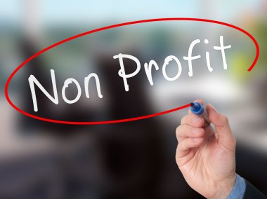 Man Hand writing Non Profit with marker on virtual screen