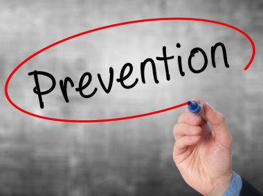 Man Hand writing Prevention with marker on visual screen