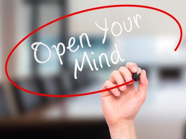 Man hand writing Open Your Mind with marker on transparent scree