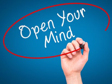 Man hand writing Open Your Mind with marker on transparent scree