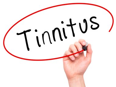 Man Hand writing Tinnitus with marker on transparent wipe board