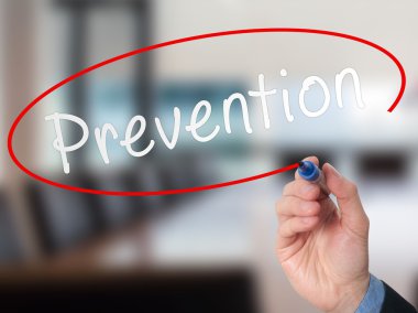 Man Hand writing Prevention with marker on visual screen