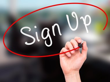 Man Hand writing Sign Up with marker on transparent wipe board