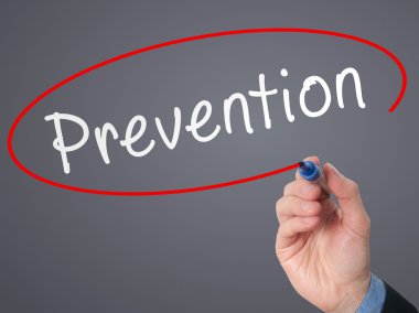 Man Hand writing Prevention with marker on visual screen