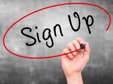 Man Hand writing Sign Up with marker on transparent wipe board