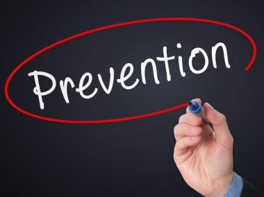 Man Hand writing Prevention with marker on visual screen