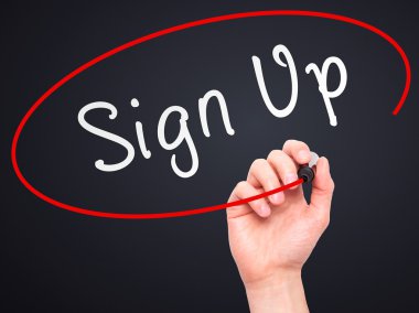 Man Hand writing Sign Up with marker on transparent wipe board