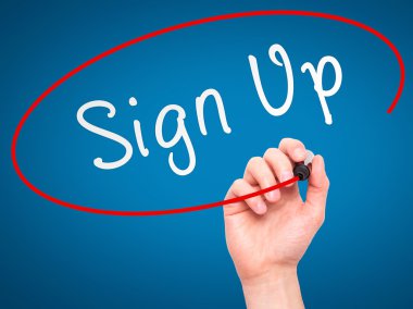 Man Hand writing Sign Up with marker on transparent wipe board