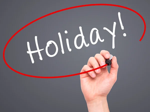 Man Hand writing Holiday! with black marker on visual screen — Stock Photo, Image