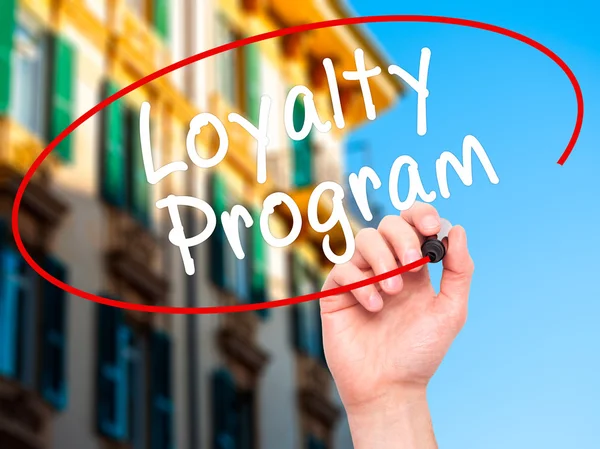 Man Hand writing Loyalty Program with black marker on visual scr — Stok fotoğraf