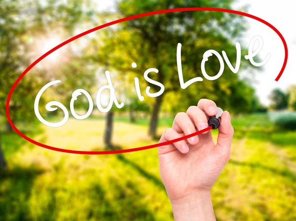Człowiek w zapasie pismo Boga jest miłość z czarnego markera na wizualne ekranie — Zdjęcie stockowe