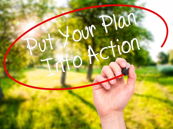 Man Hand writing Put Your Plan Into Action with black marker on — Stock Photo, Image