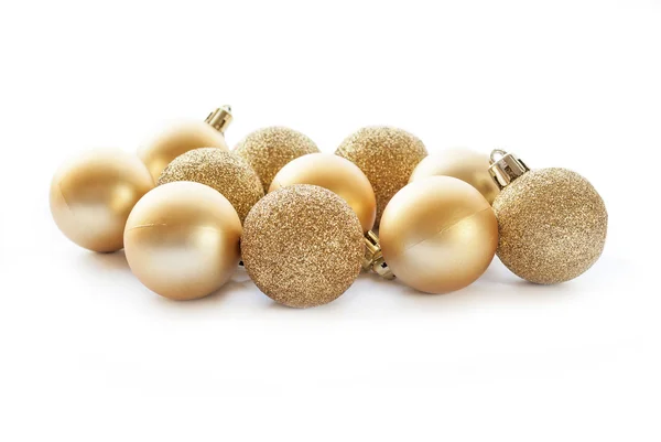 Gold Christmas balls on white background Royalty Free Stock Images