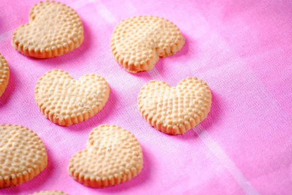 Heart shaped cookies on pink cloth — Stock Photo, Image