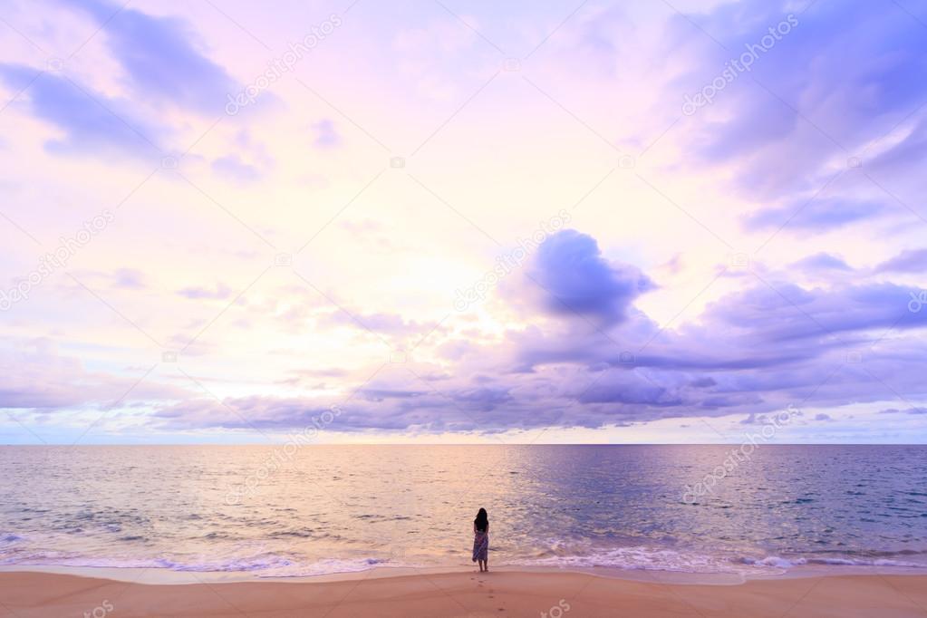 one women standing on soft cloud and sunset background with a pa