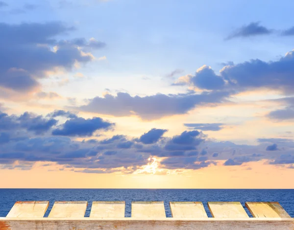 Old wood table and tropical sea and pastel sky on background.Spring or summer abstract nature background.