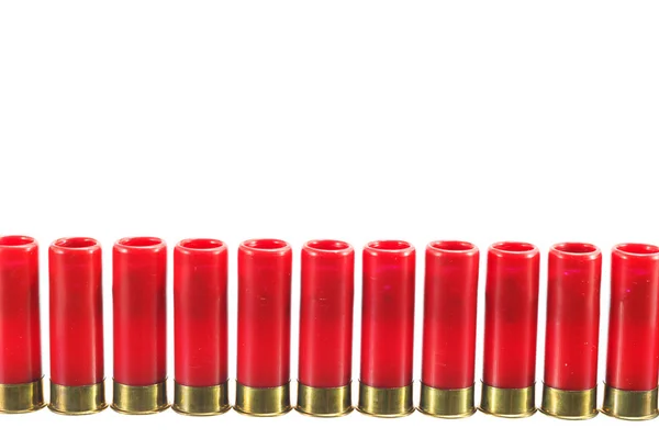 Een rode shotgun shell kogel op een witte achtergrond. — Stockfoto