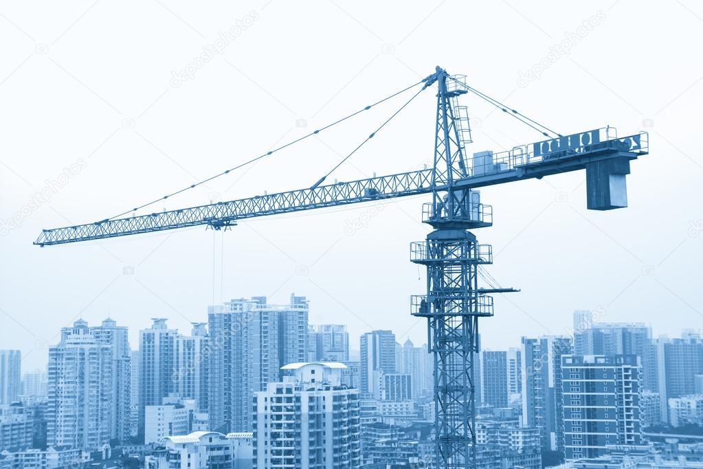 a crane in the constructing site, Guangzhou residential area in 