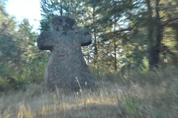 The marble statue of a woman enchanted stone. The Legend of witchcraft. Cross. — Stock Photo, Image