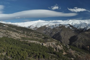Sierra Nevada mountains in southern Spain, near Pradollano. Snow-capped peaks. clipart