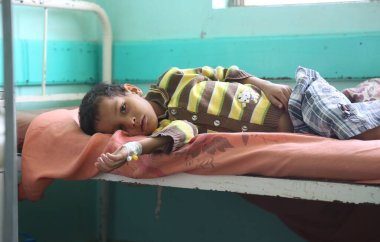 Taiz / Yemen - 29 June 2017 : A child suffering from cholera in Taiz, Yemen. clipart