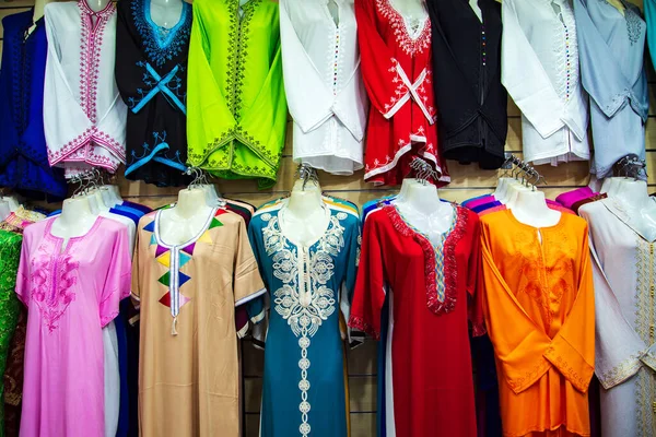 Bright national clothes on the Moroccan market. Traditional jellaba, Marrakech, Morocco.